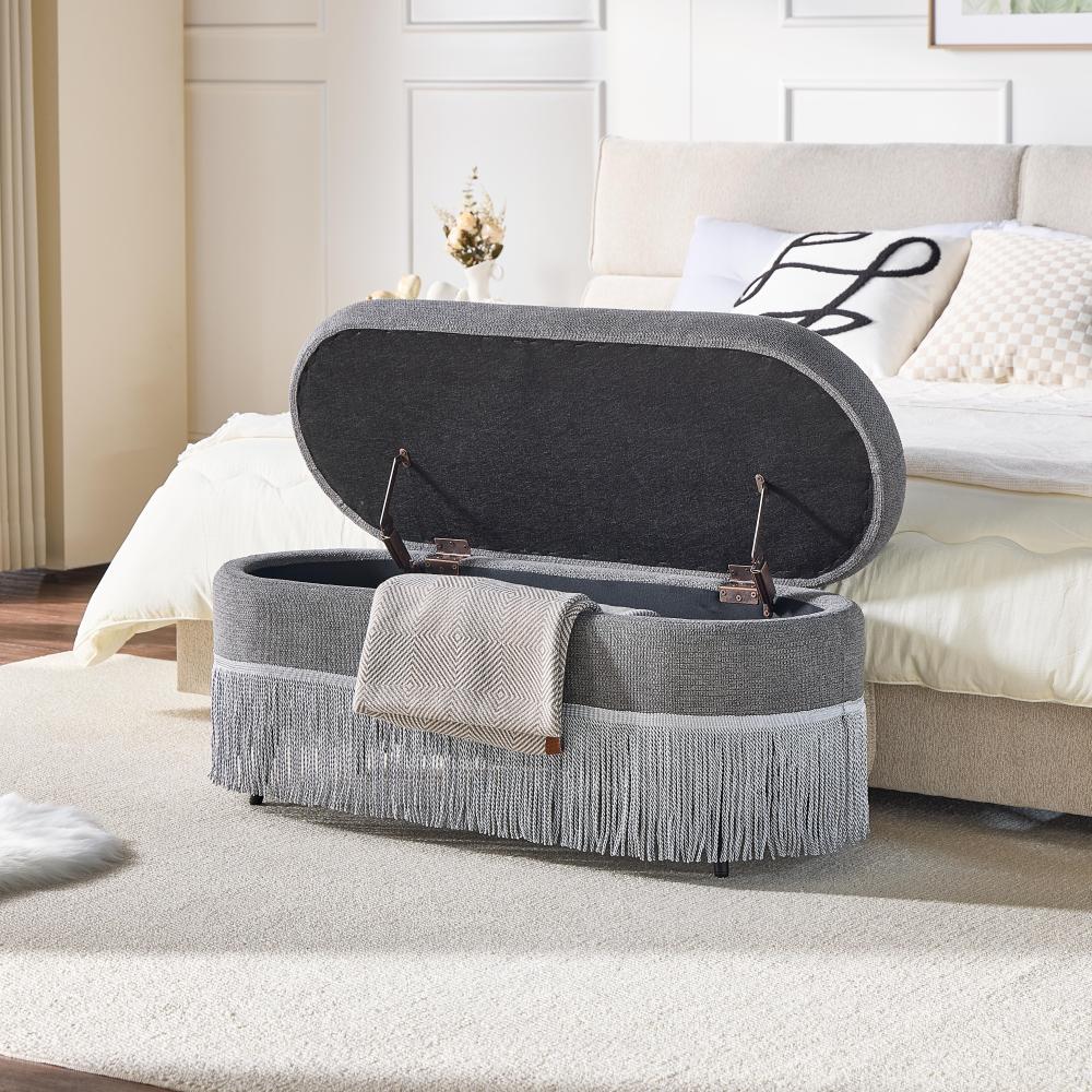 Oval Upholstered Storage Ottoman with Fringe Trim & Lift-Top Lid - 39"L x 16"W x 17"H, Multi-Functional Footrest & Hidden Storage for Living Room or Bedroom - Grey Fabric with Metal Frame