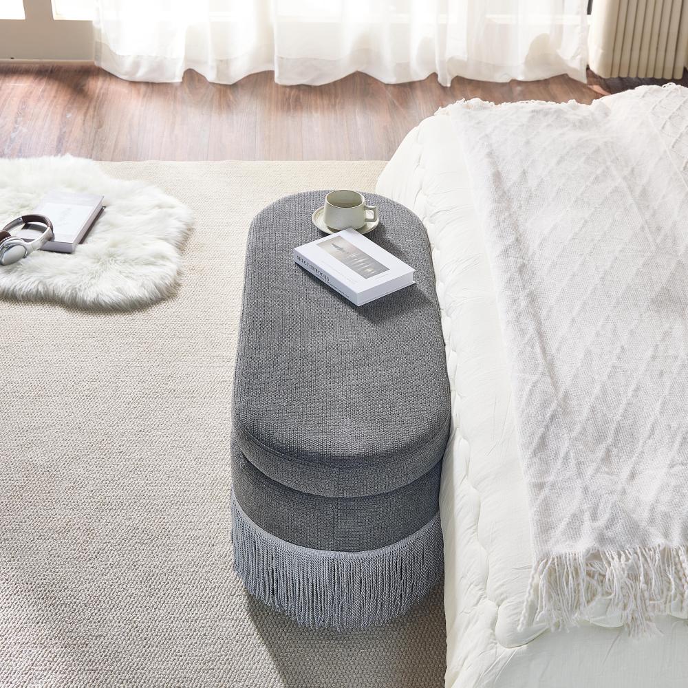 Oval Upholstered Storage Ottoman with Fringe Trim & Lift-Top Lid - 39"L x 16"W x 17"H, Multi-Functional Footrest & Hidden Storage for Living Room or Bedroom - Grey Fabric with Metal Frame