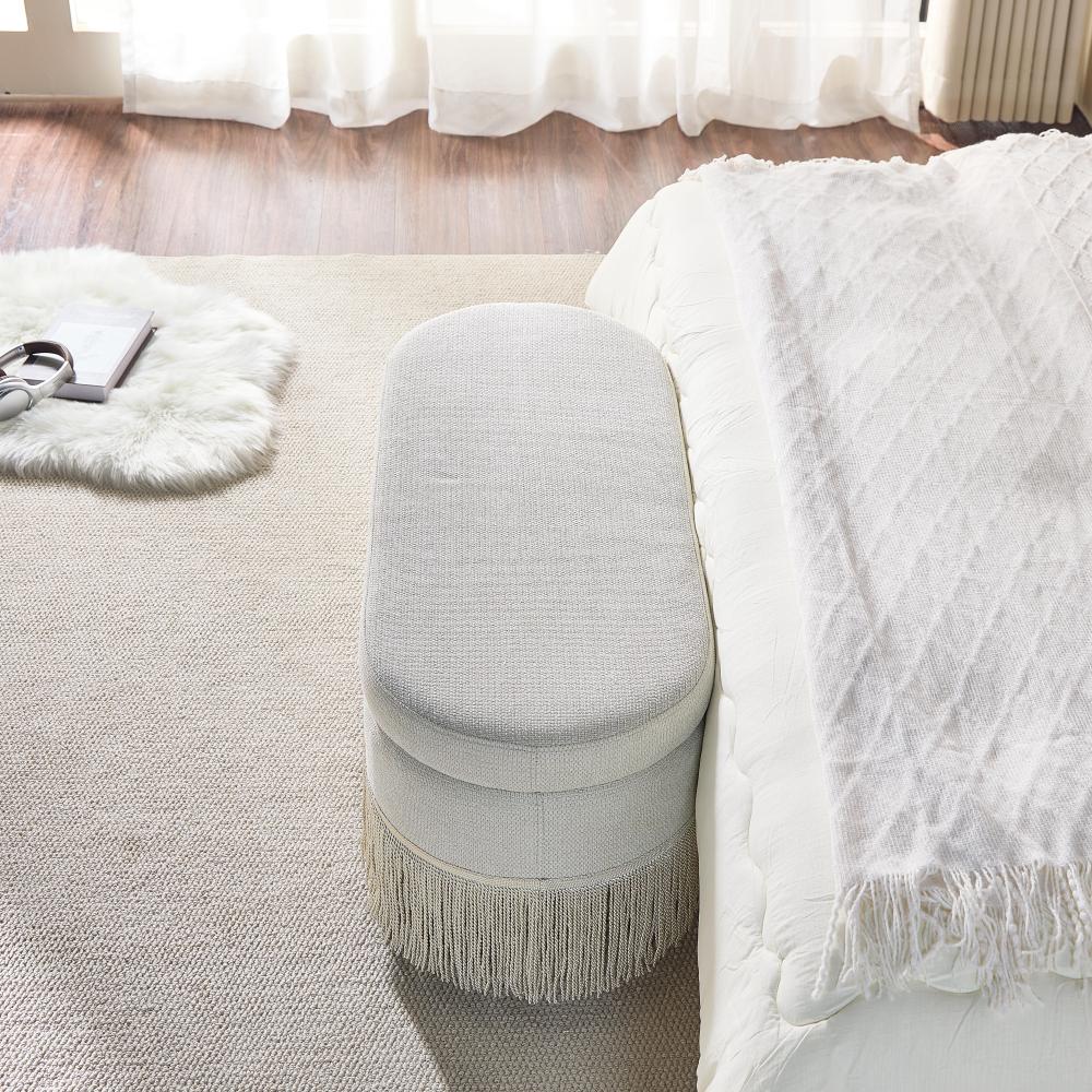 Oval Upholstered Storage Ottoman with Fringe Trim, 39.4 Inch Lift-Top Ottoman Bench for Living Room, Beige Multi-Functional Footrest with Hidden Storage, Sturdy Metal Frame & Foam Padding for Bedroom or Entryway